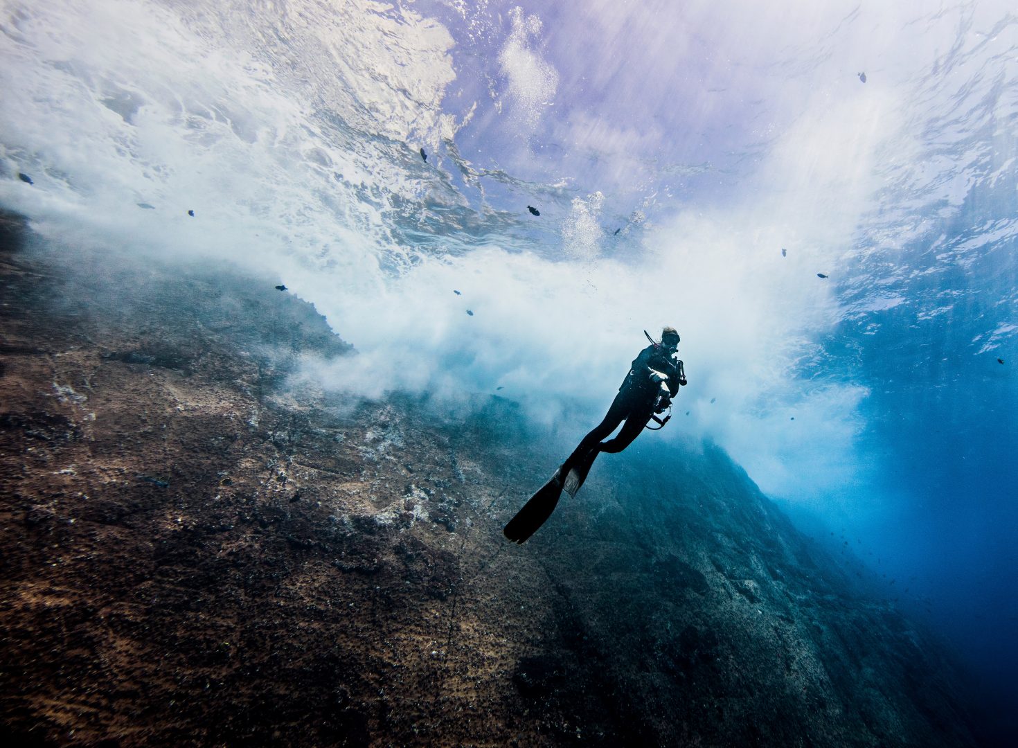 Silhouette of diver underwater exploring ocean