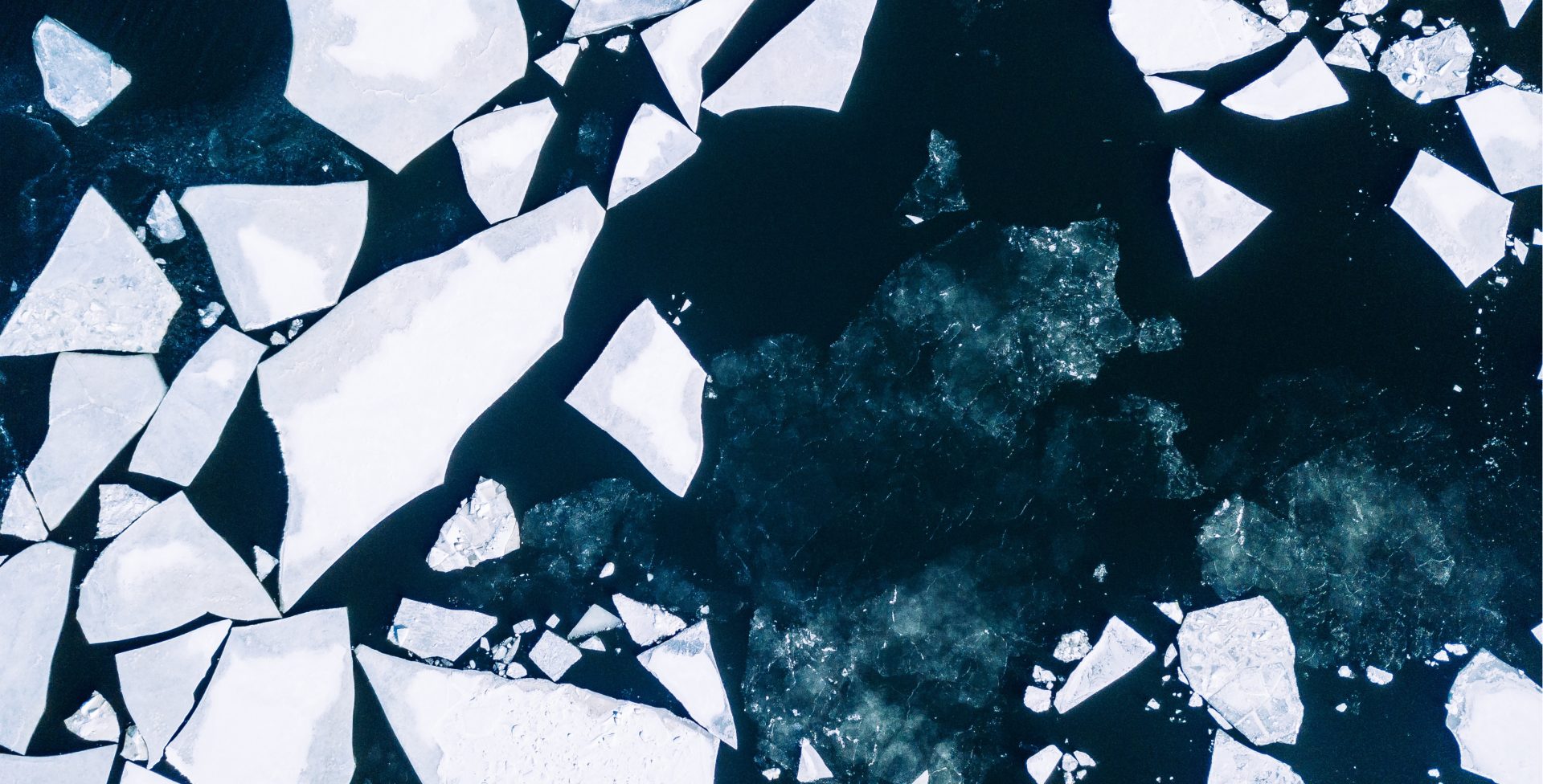 Aerial view of broken ice sheets in ocean