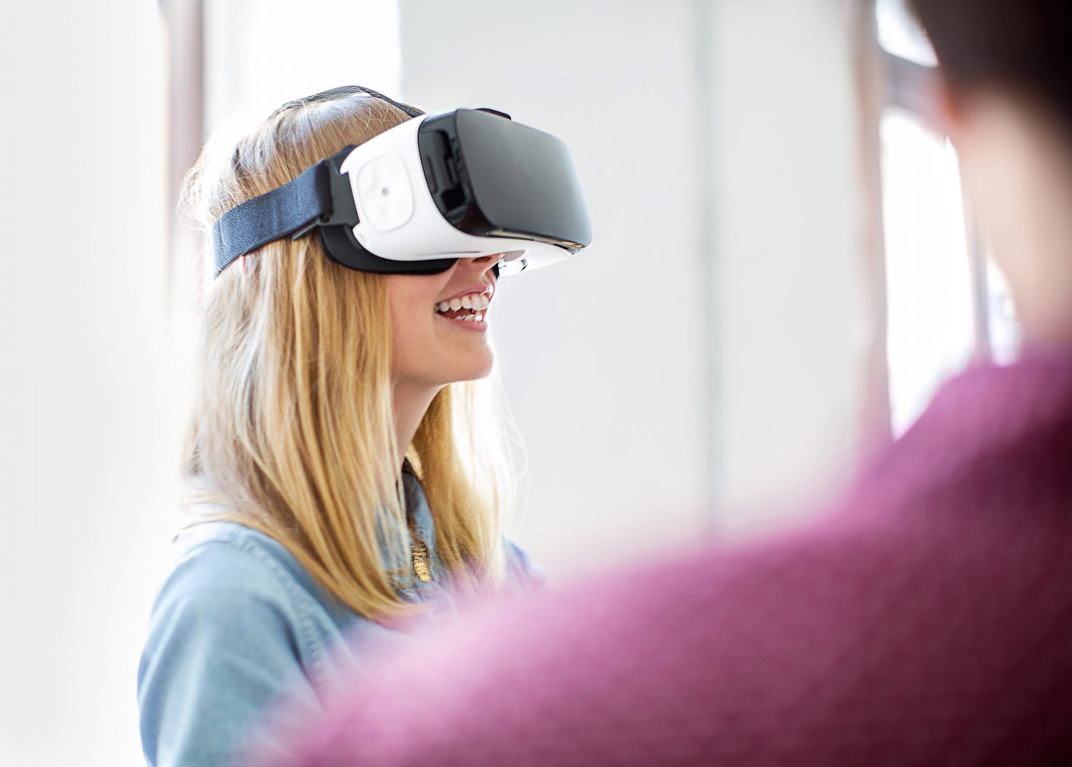 Smiling woman wearing virtual reality headset